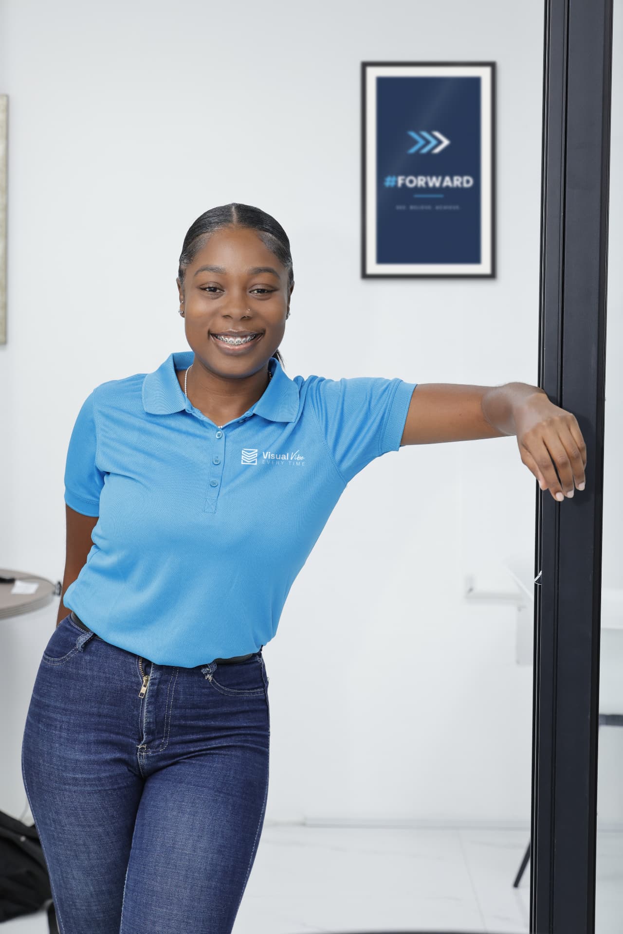 Zhadesha Elliott, General Manager – Client Acquisition at Visual Vibe, smiling in the Visual Vibe office